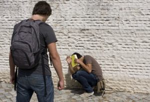 A picture of a teen bullying another showing what can happen without training in our teen classes.